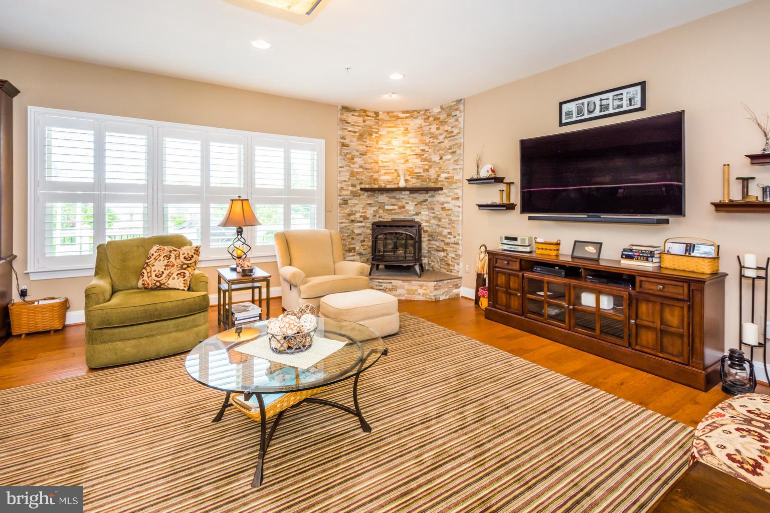 9752 Powder Hall Road Perry Hall, MD 21128 - Photo 32 of 129 FAMILY ROOM - GAS STOVE WITH STONE HEARTH