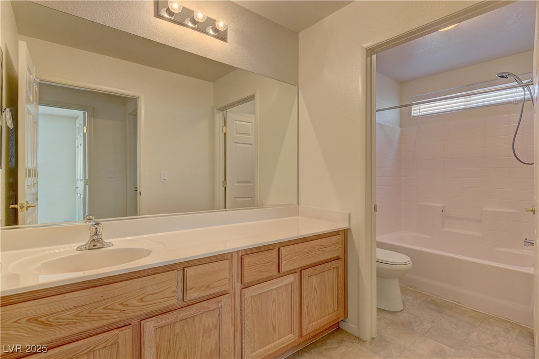 10403 Madagascar Palm Street Las Vegas, NV 89141 - Photo 20 of 21 Full bathroom with vanity and bathing tub / shower combination