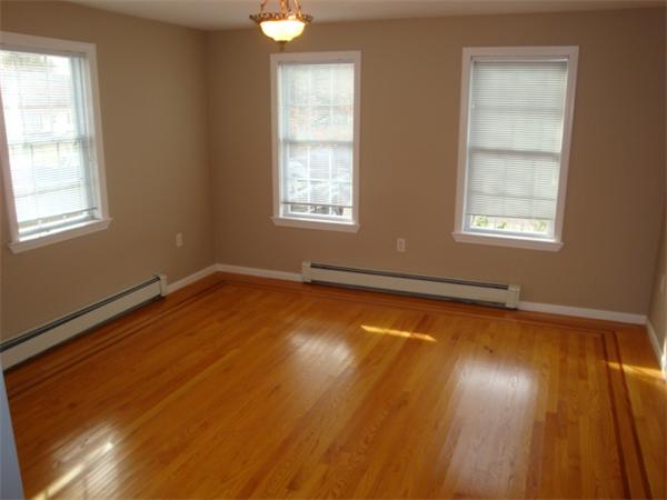 106 Desoto Road Boston, MA 02132 - Photo 11 of 27 a view of room with window and wooden floor