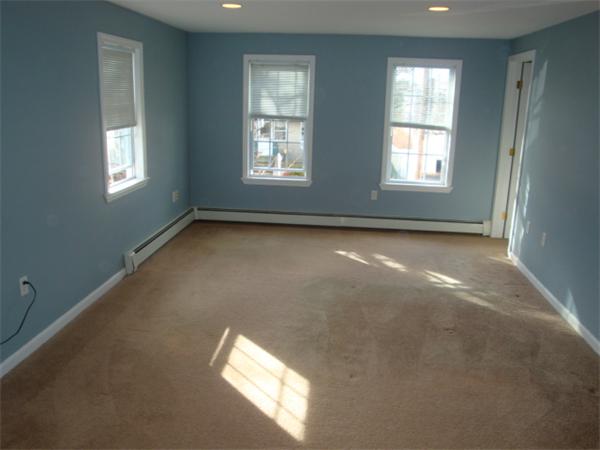 106 Desoto Road Boston, MA 02132 - Photo 12 of 27 a view of empty room with windows
