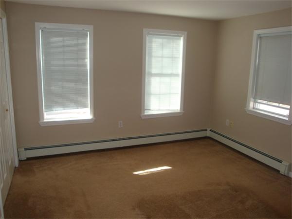 106 Desoto Road Boston, MA 02132 - Photo 19 of 27 an empty room with a window