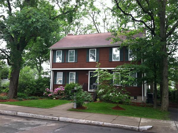106 Desoto Road Boston, MA 02132 - Photo 2 of 27 a front view of a house with a yard