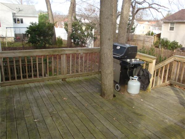 106 Desoto Road Boston, MA 02132 - Photo 23 of 27 a view of a deck with wooden floor and seating space