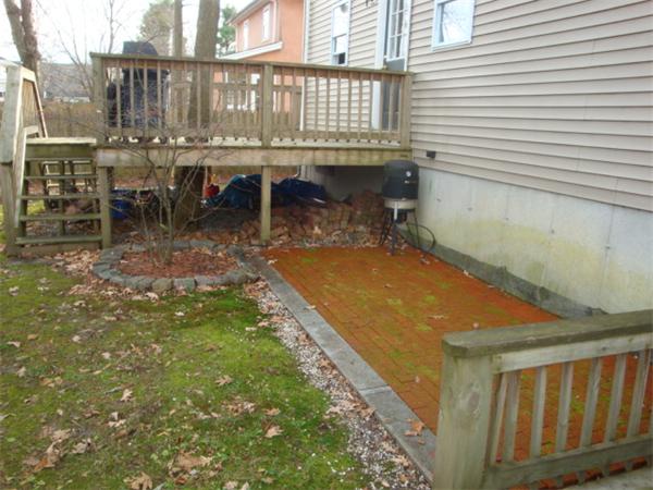106 Desoto Road Boston, MA 02132 - Photo 24 of 27 a backyard of a house with table and chairs