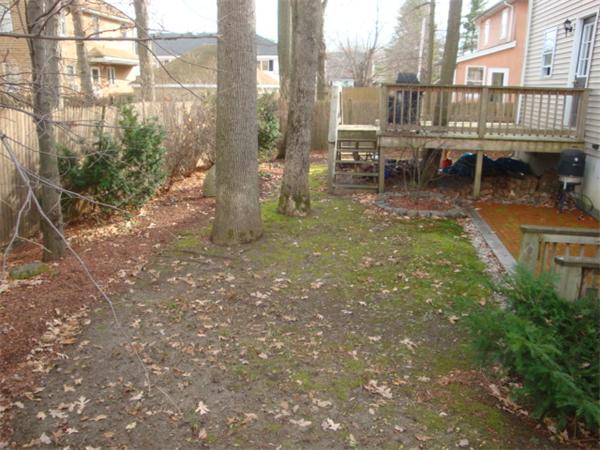 106 Desoto Road Boston, MA 02132 - Photo 25 of 27 a backyard of a house with table and chairs