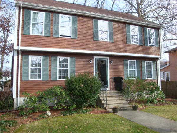106 Desoto Road Boston, MA 02132 - Photo 26 of 27 a view of brick house with a yard plants and large tree