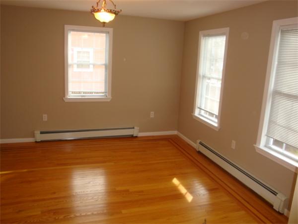 106 Desoto Road Boston, MA 02132 - Photo 10 of 27 a view of a room with wooden floor and a window