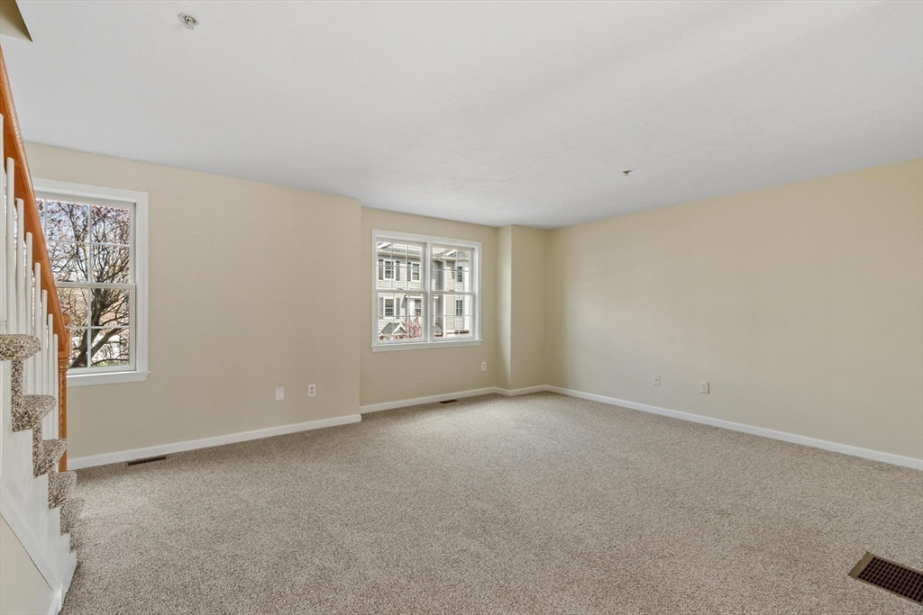 1975 Middlesex Street, Unit 33 Lowell, MA 01851 - Photo 6 of 18 an empty room with windows