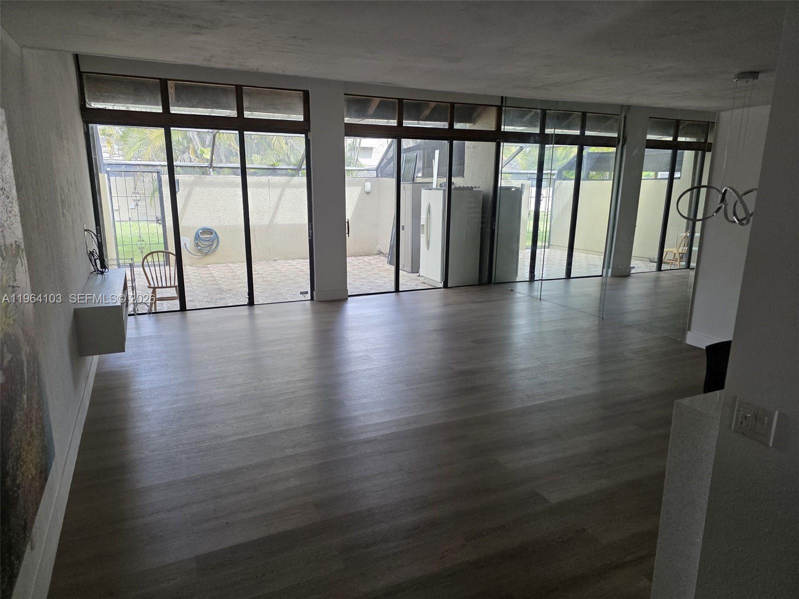 10951 Cypress Road, Unit 10951 Pembroke Pines, FL 33026 - Photo 12 of 27 a view of an entryway with wooden floor