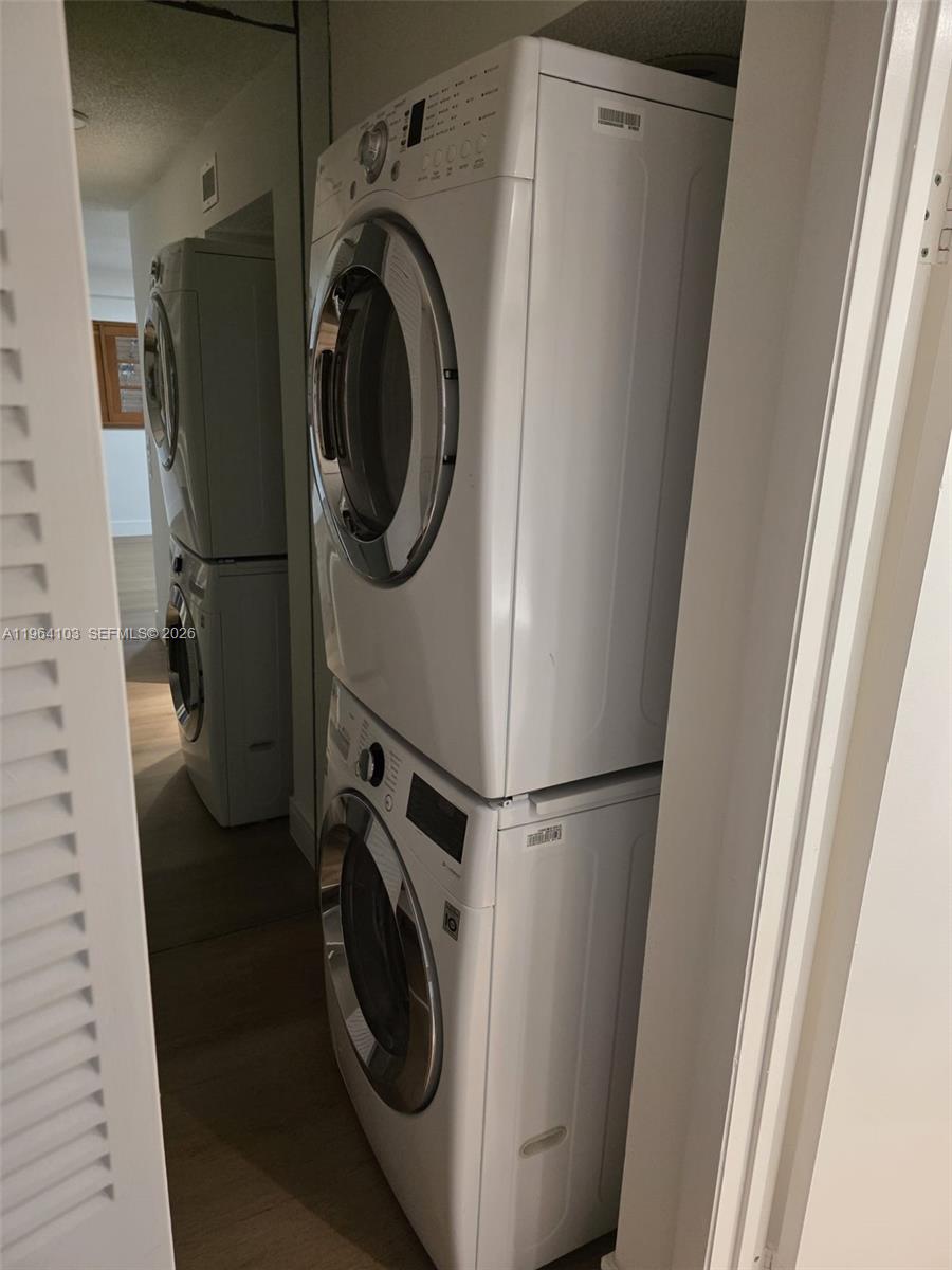 10951 Cypress Road, Unit 10951 Pembroke Pines, FL 33026 - Photo 25 of 27 a utility room with dryer and washer
