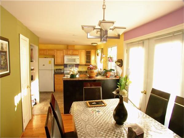 32 Junction Street, Unit 2 Needham, MA 02492 - Photo 4 of 17 a view of a dining room with furniture window and outside view