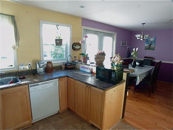32 Junction Street, Unit 2 Needham, MA 02492 - Photo 6 of 17 a kitchen with a sink stove and cabinets