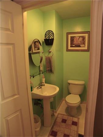 32 Junction Street, Unit 2 Needham, MA 02492 - Photo 8 of 17 a bathroom with a toilet a sink and mirror