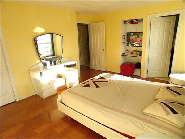 32 Junction Street, Unit 2 Needham, MA 02492 - Photo 9 of 17 a bedroom with a bed and wooden floor