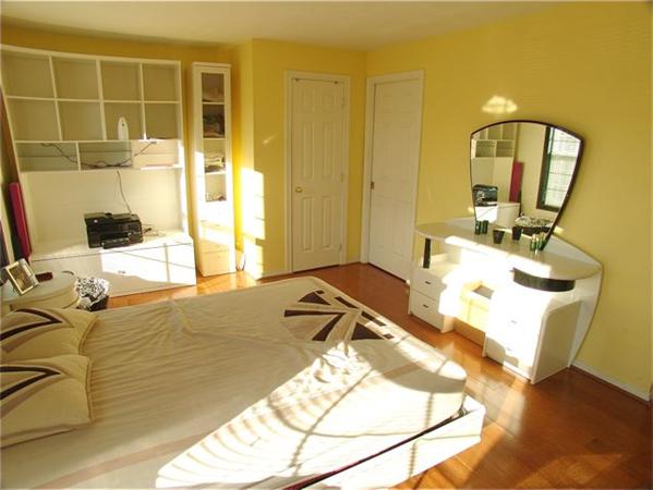 32 Junction Street, Unit 2 Needham, MA 02492 - Photo 10 of 17 a room with a bed and a mirror