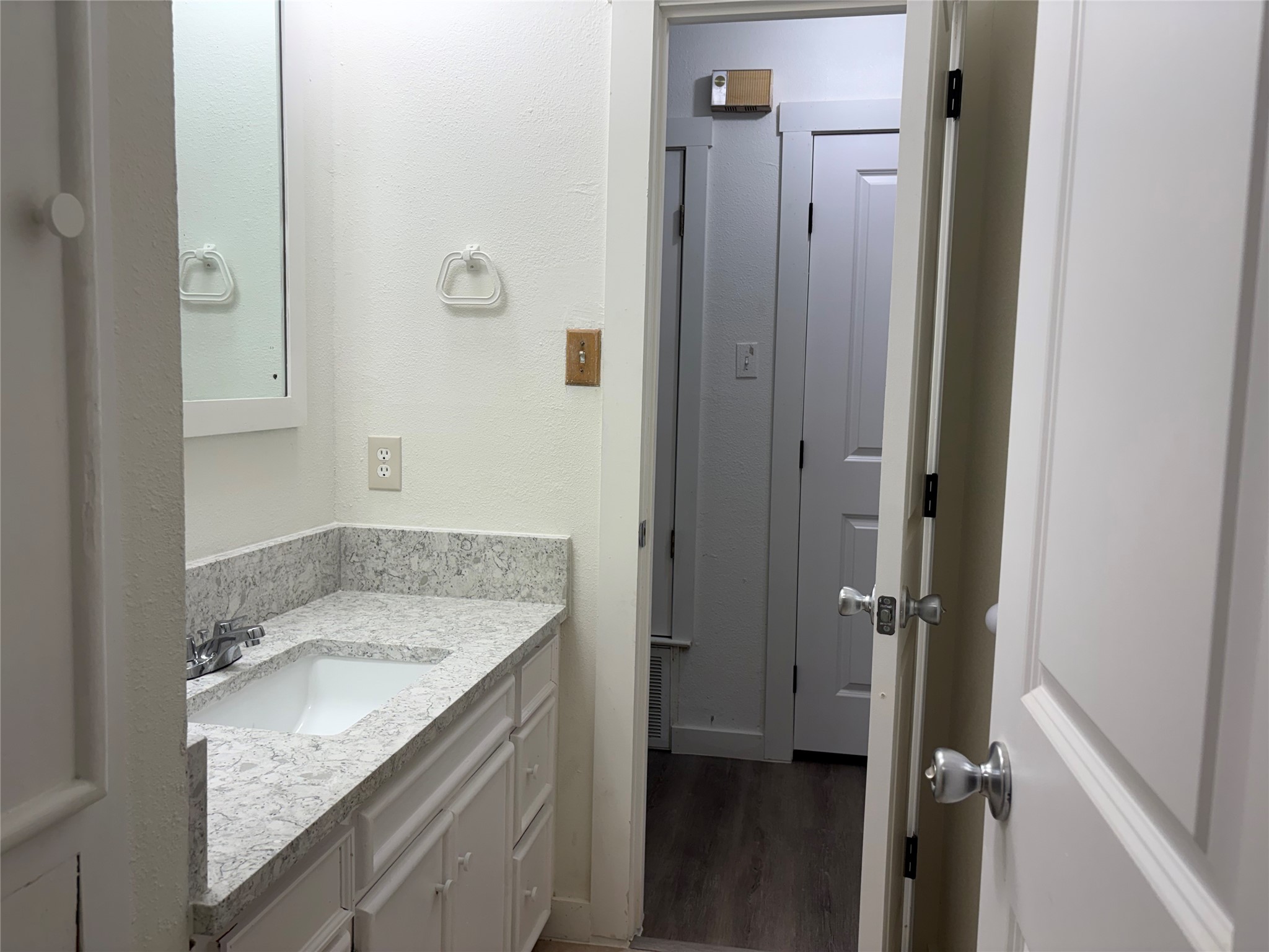 11913 Rennalee Loop Austin, TX 78753 - Photo 29 of 40 A well-appointed bathroom vanity features a stone counter and ample storage.