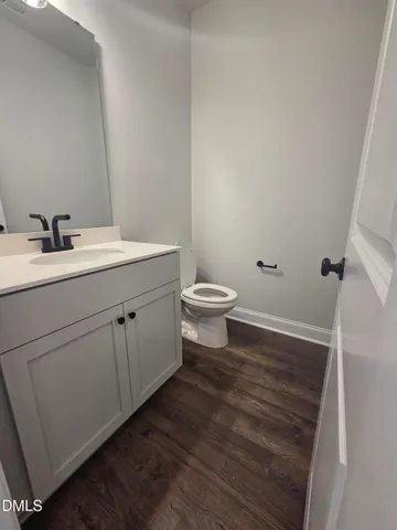 a view of bathroom with a sink and mirror