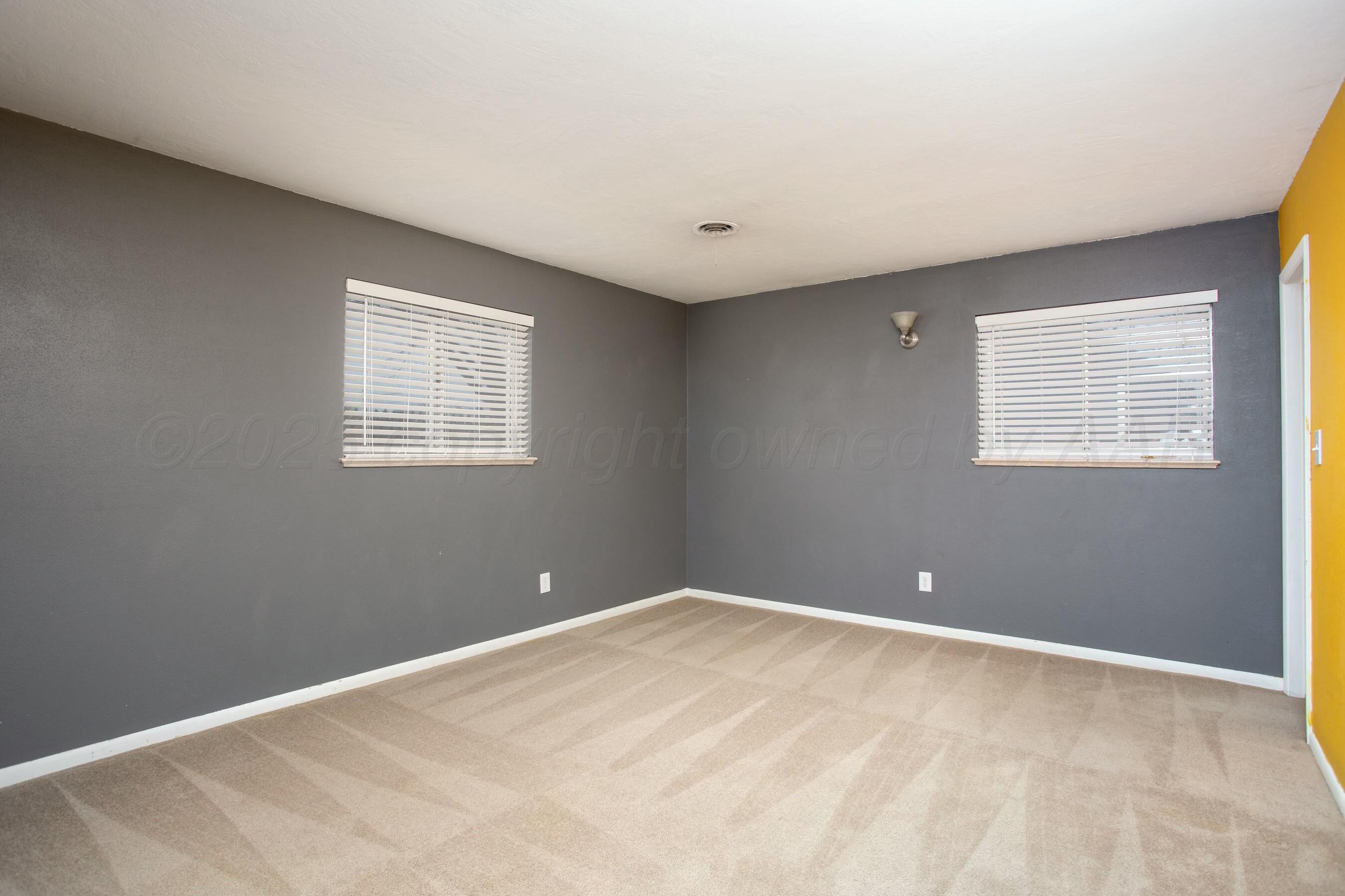 3621 Thurman Street Amarillo, TX 79109 - Photo 12 of 29 a view of a big room with windows