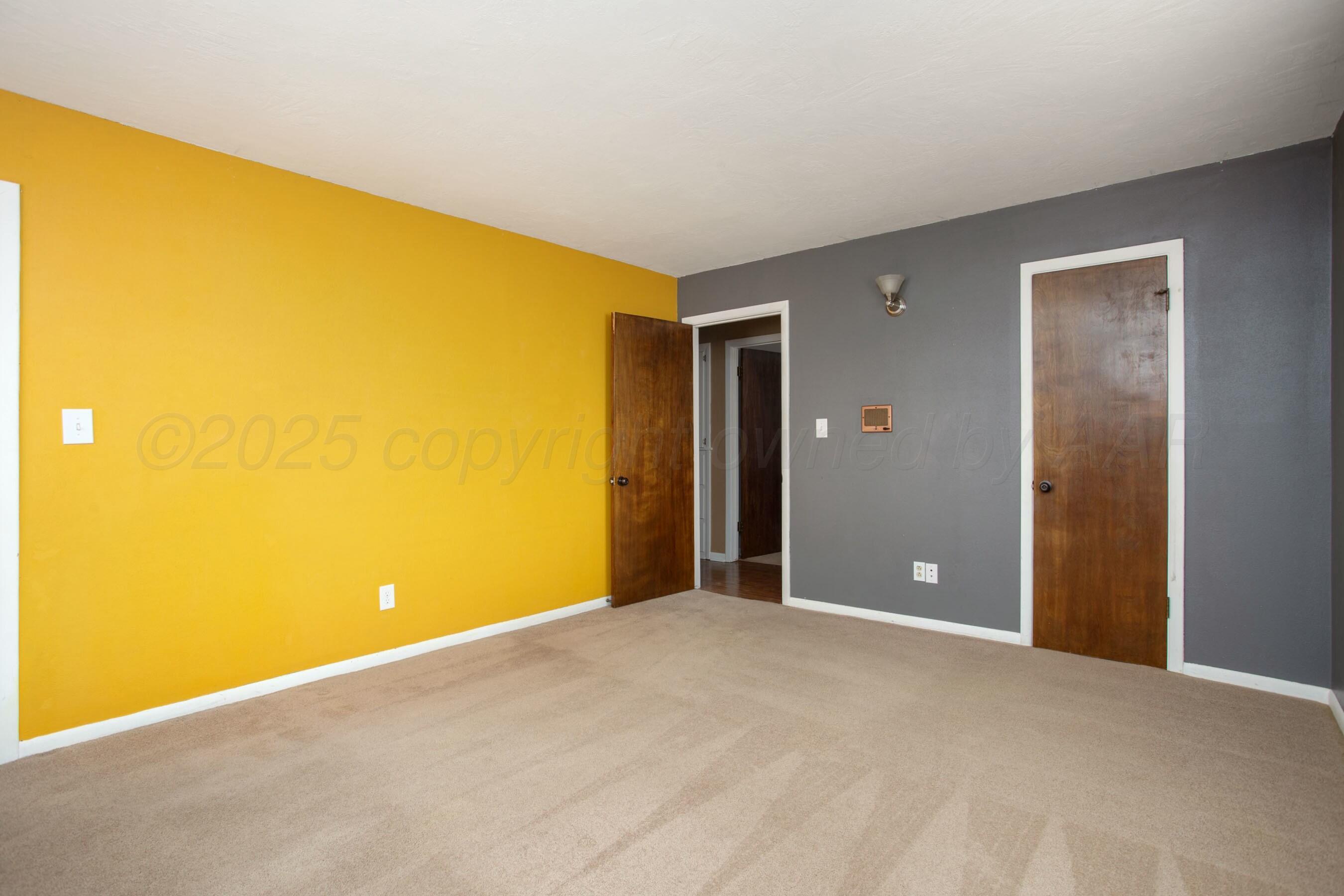 3621 Thurman Street Amarillo, TX 79109 - Photo 14 of 29 a view of an empty room with a window