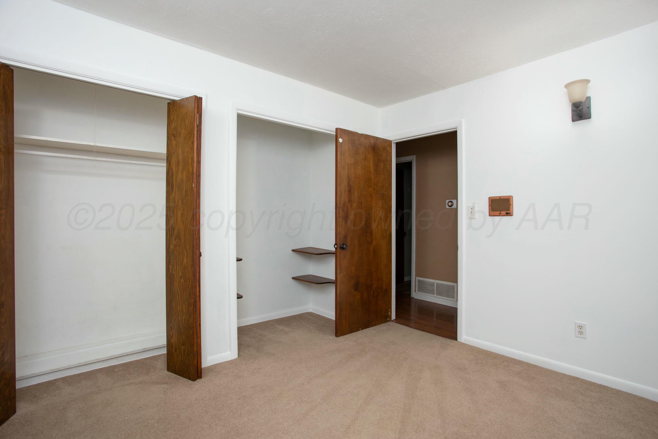 3621 Thurman Street Amarillo, TX 79109 - Photo 18 of 29 an empty room with closet and a bathroom