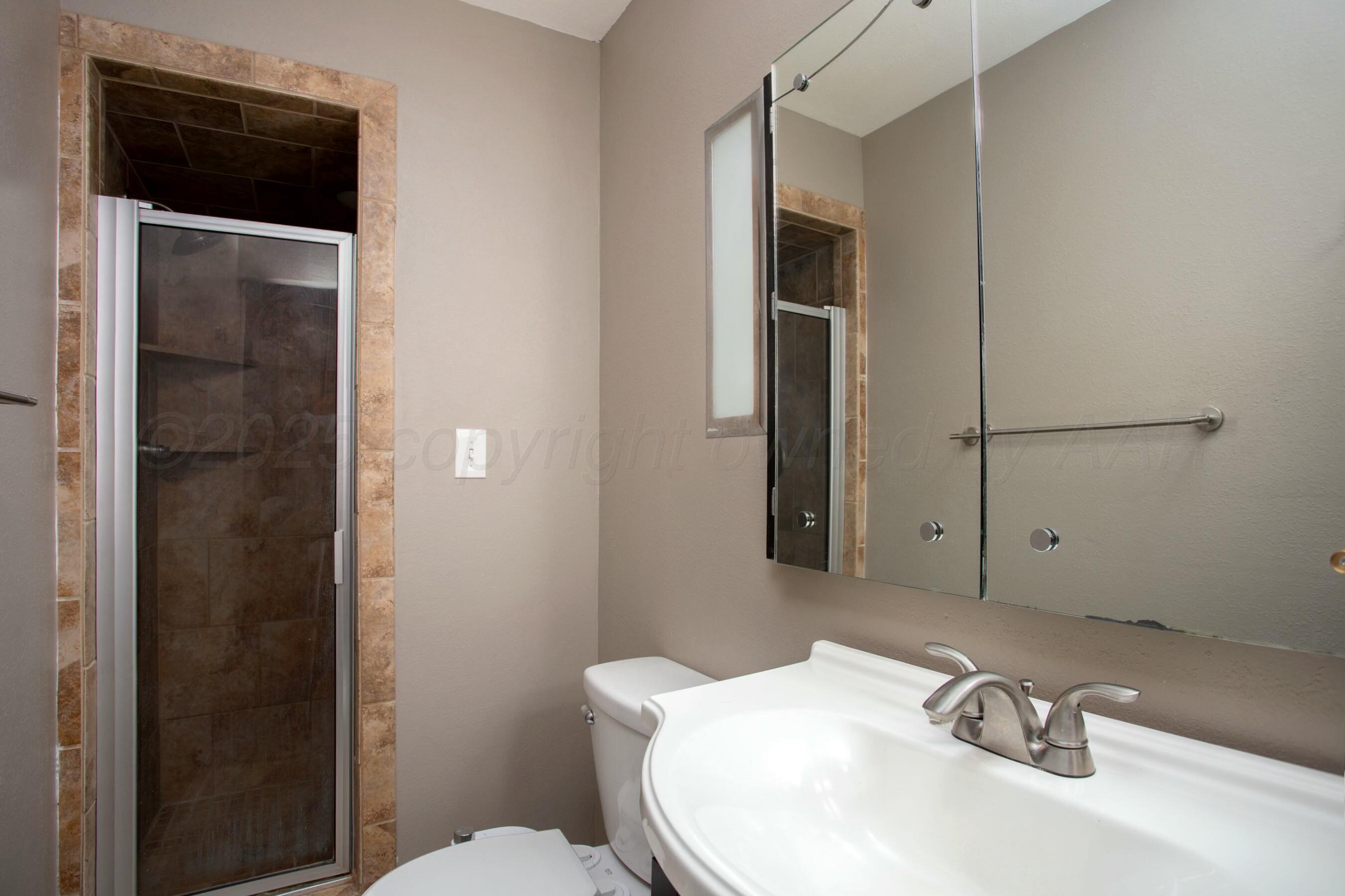 3621 Thurman Street Amarillo, TX 79109 - Photo 21 of 29 a bathroom with a sink and a toilet