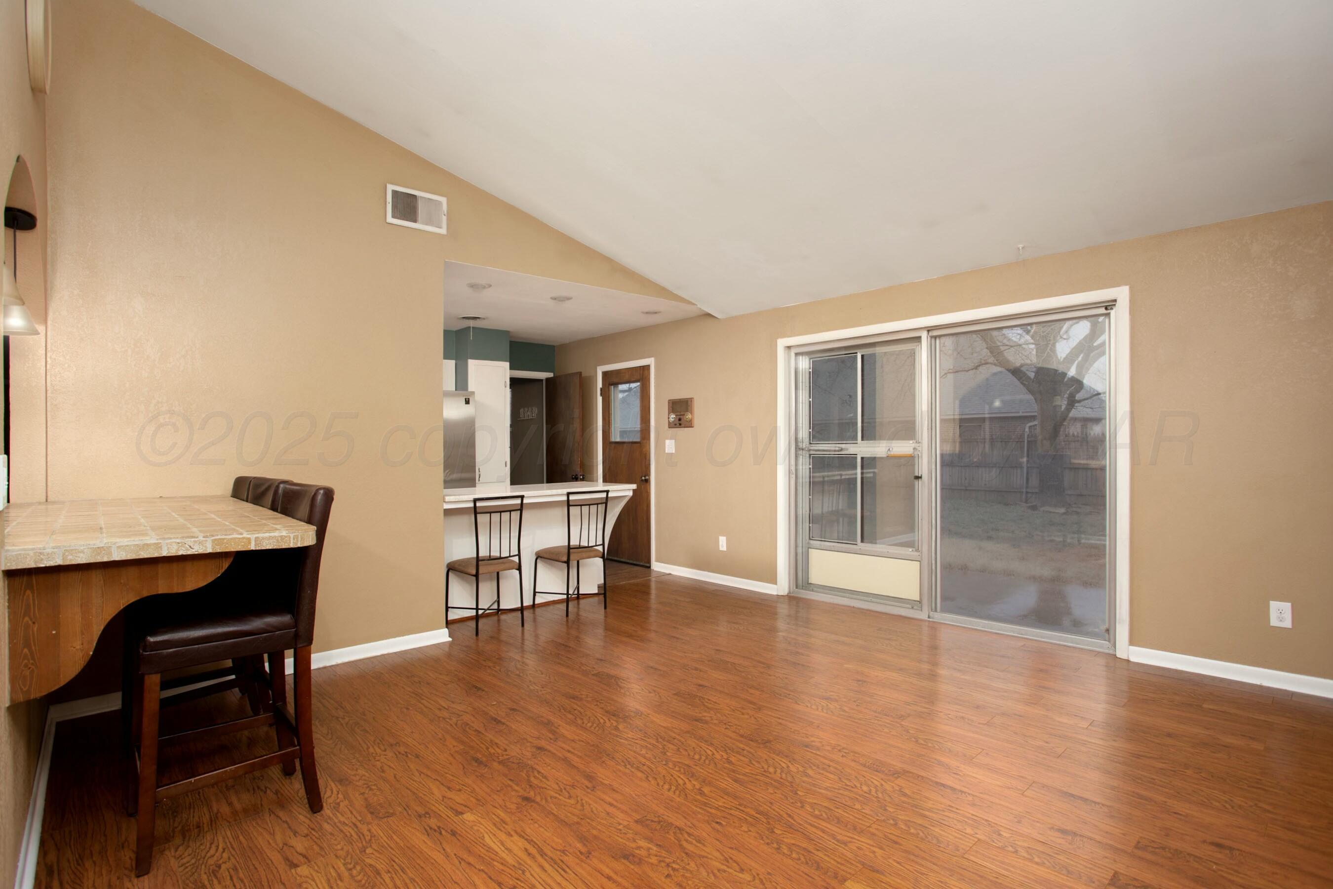 3621 Thurman Street Amarillo, TX 79109 - Photo 8 of 29 a view of a livingroom with furniture and wooden floor