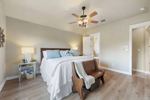 a bed room with a bed and a chair