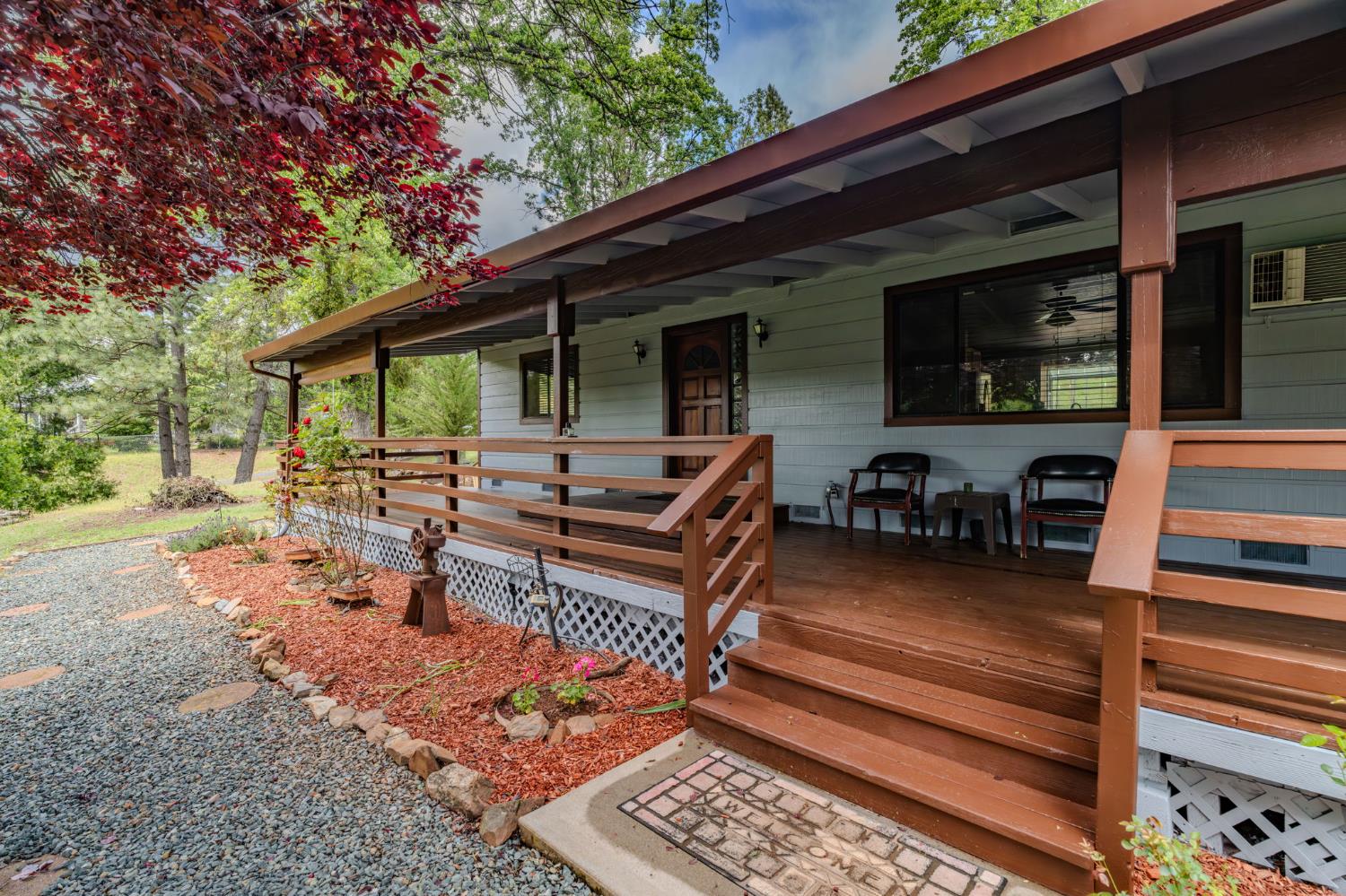 a view of a backyard with sitting area