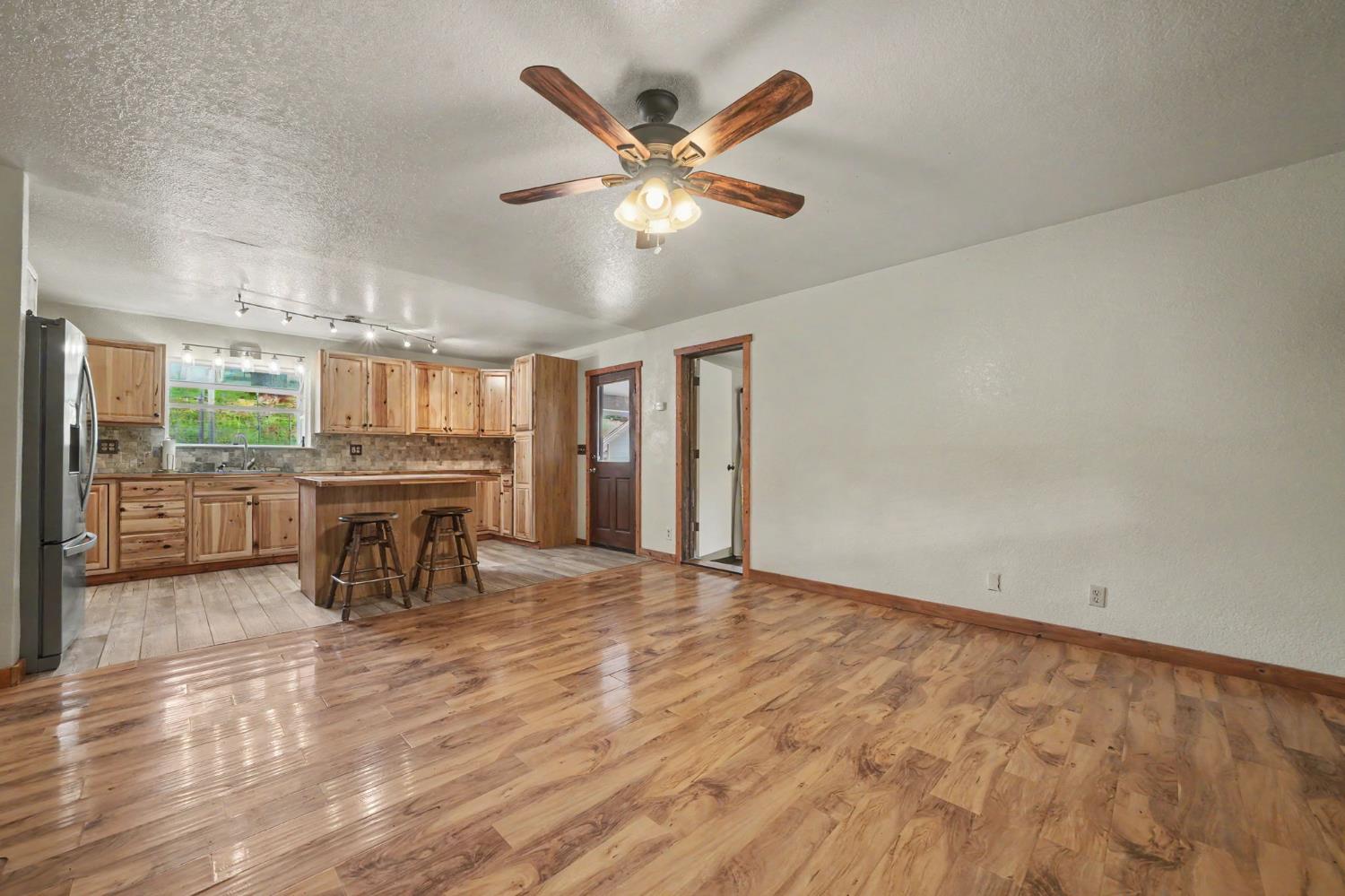 4821 Old Emigrant Trail East Mountain Ranch, CA 95246 - Photo 13 of 65 a living room with furniture and kitchen view