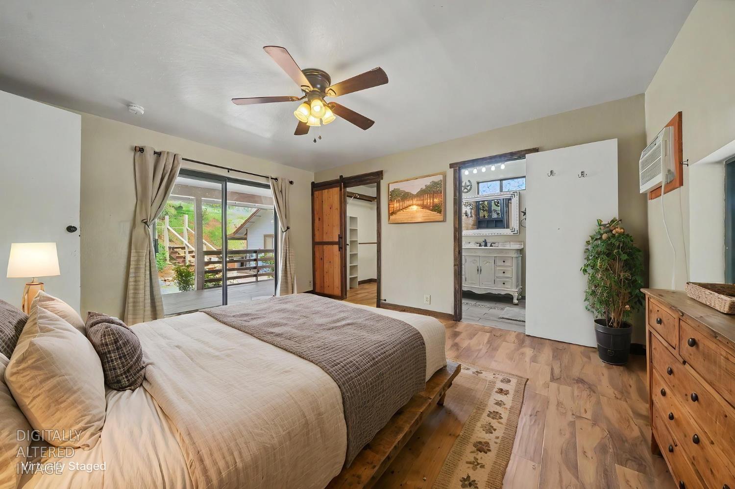 4821 Old Emigrant Trail East Mountain Ranch, CA 95246 - Photo 20 of 65 a spacious bedroom with a bed and a dresser