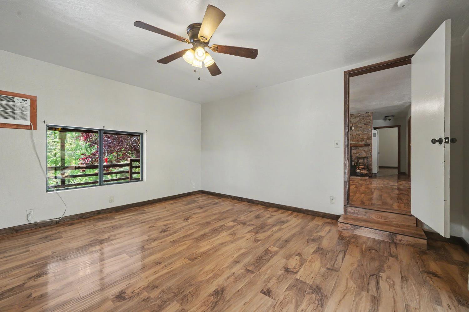 4821 Old Emigrant Trail East Mountain Ranch, CA 95246 - Photo 24 of 65 wooden floor in an empty room with a window