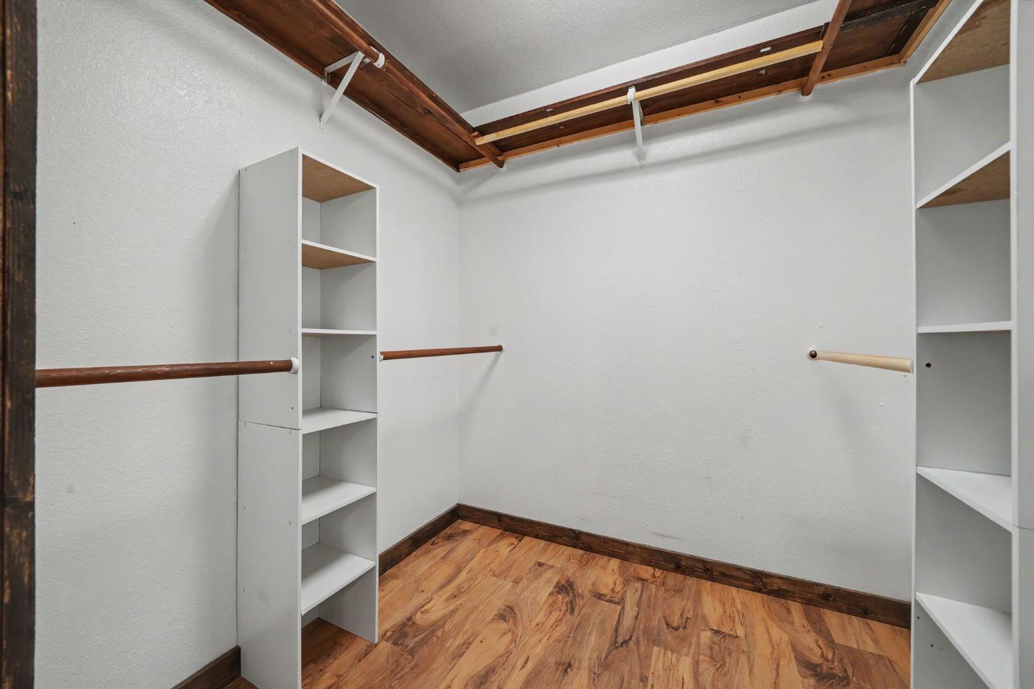 4821 Old Emigrant Trail East Mountain Ranch, CA 95246 - Photo 27 of 65 a view of walk in closet with empty racks