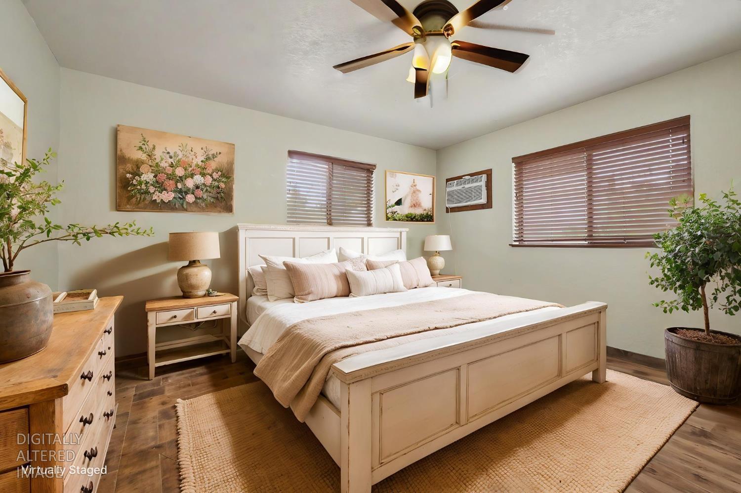4821 Old Emigrant Trail East Mountain Ranch, CA 95246 - Photo 28 of 65 a bedroom with a large bed and a chandelier