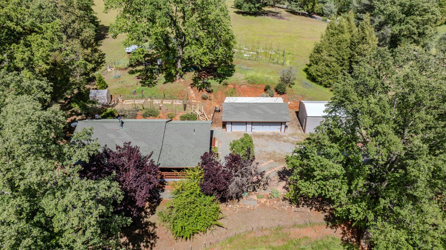 4821 Old Emigrant Trail East Mountain Ranch, CA 95246 - Photo 58 of 65 an aerial view of a house with outdoor space and trees all around