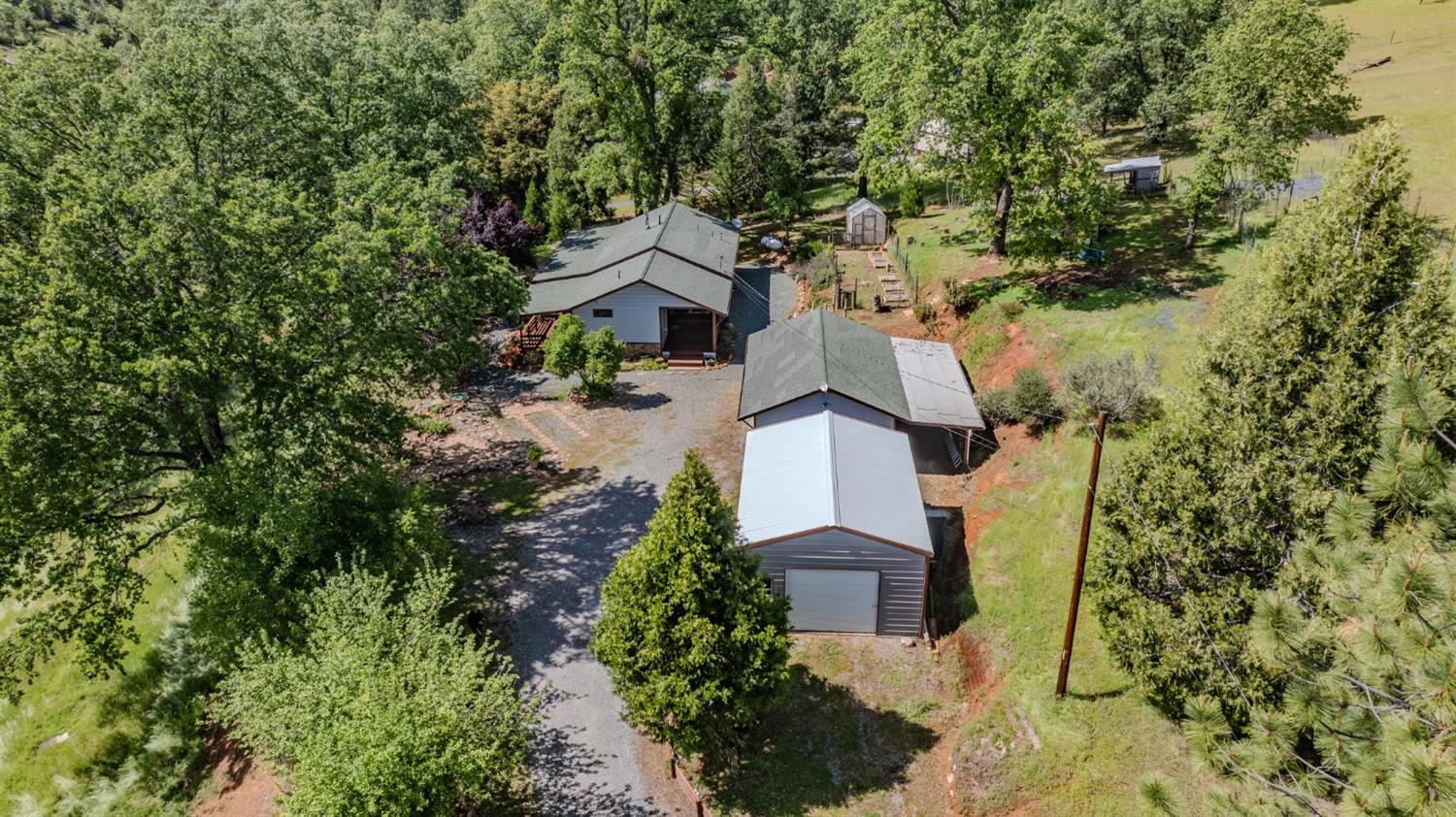 4821 Old Emigrant Trail East Mountain Ranch, CA 95246 - Photo 62 of 65 an aerial view of a house with a yard