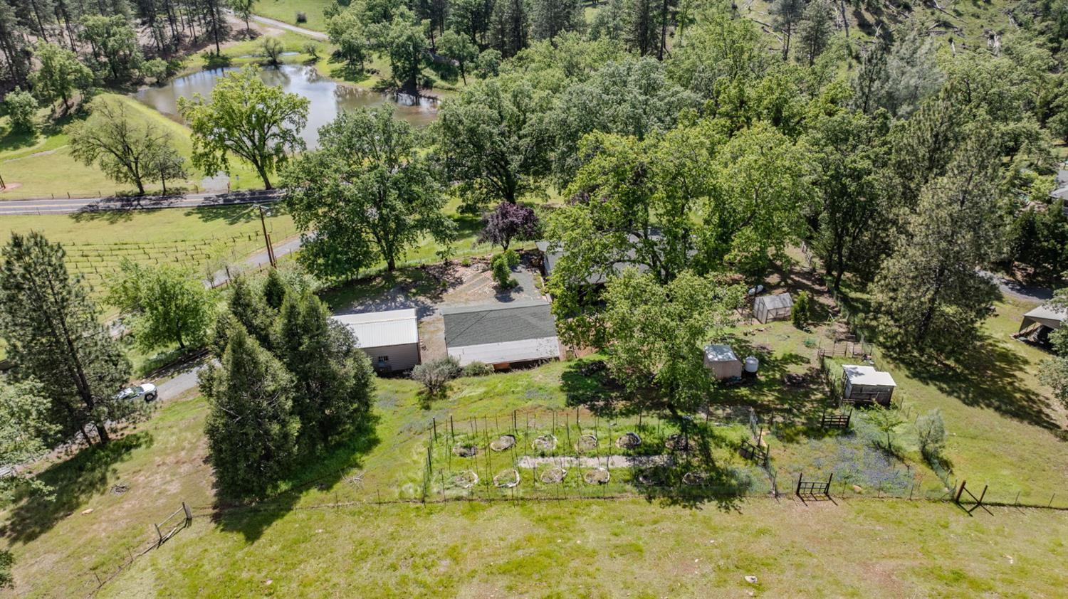 4821 Old Emigrant Trail East Mountain Ranch, CA 95246 - Photo 63 of 65 an aerial view of a house with a yard