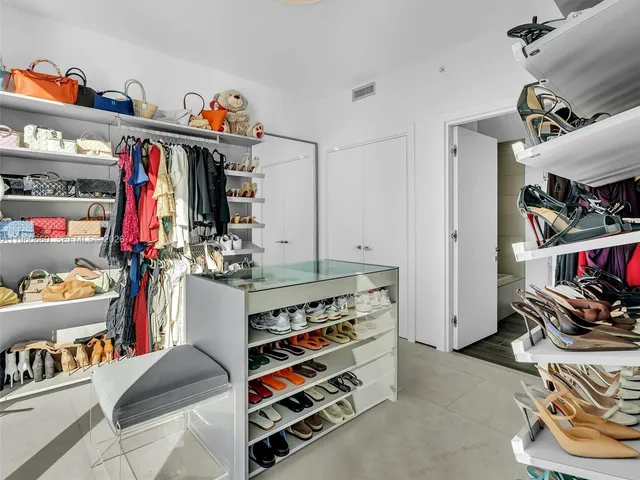 a spacious bathroom with a tub sink and mirror