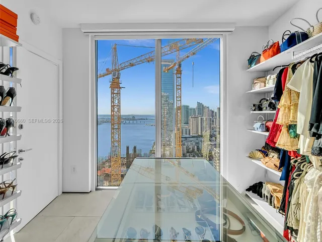 a living room with lots of furniture and a table