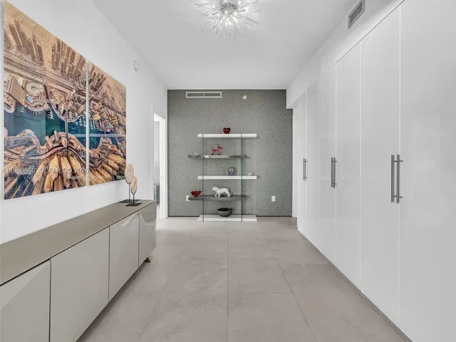 a bathroom with a shower a toilet and a sink