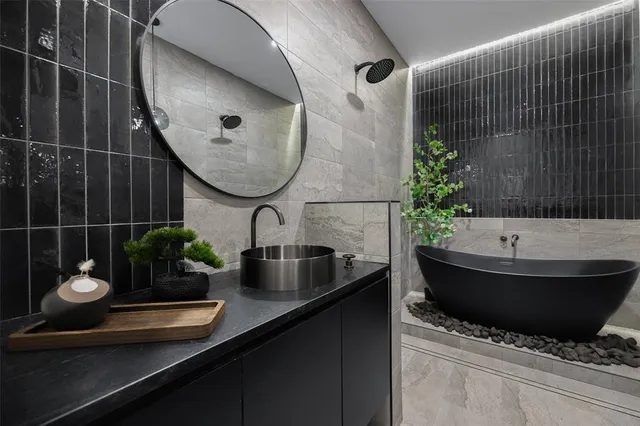 a bathroom with a sink and mirror