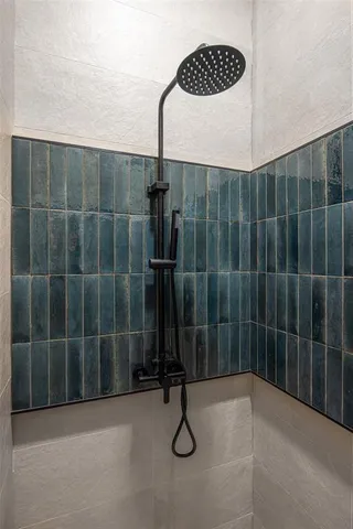 a living room with a bed and furniture