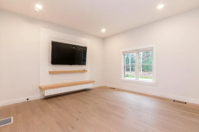 a view of kitchen and kitchen with stainless steel appliances