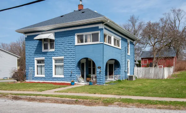 a front view of a house with a yard