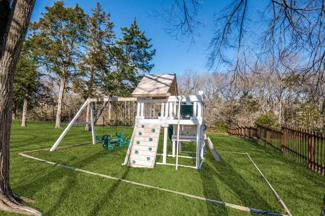 a view of a room with wooden floor and staircase