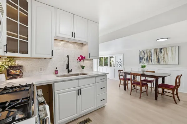 a kitchen with a sink and cabinets