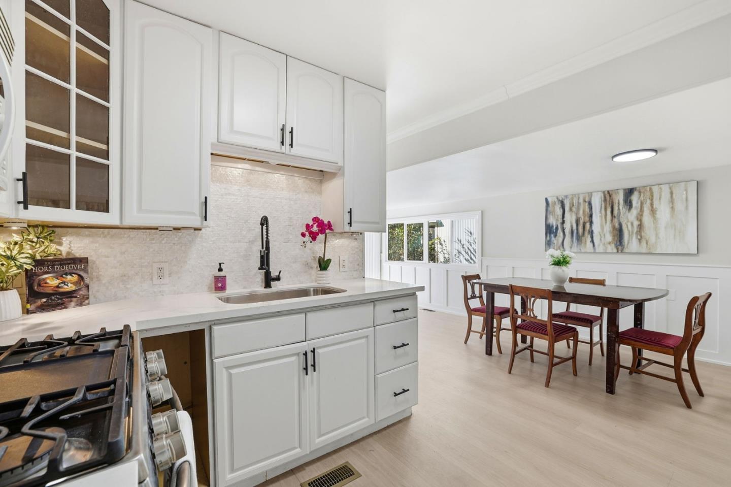 a kitchen with a sink and cabinets