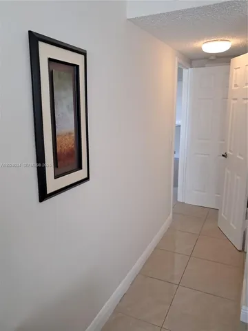 a kitchen with stainless steel appliances granite countertop a sink stove and microwave