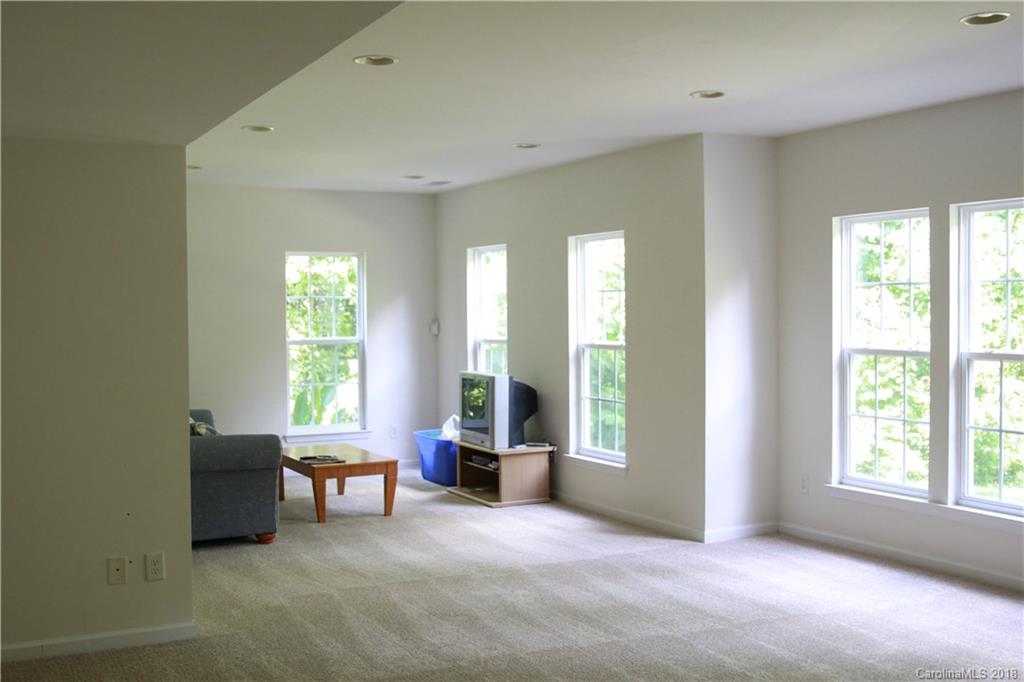 285 Choate Avenue Fort Mill, SC 29708 - Photo 22 of 24 a spacious bedroom with a bed and a large window