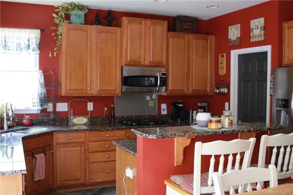 285 Choate Avenue Fort Mill, SC 29708 - Photo 10 of 24 a kitchen with stainless steel appliances granite countertop a stove a sink and a microwave