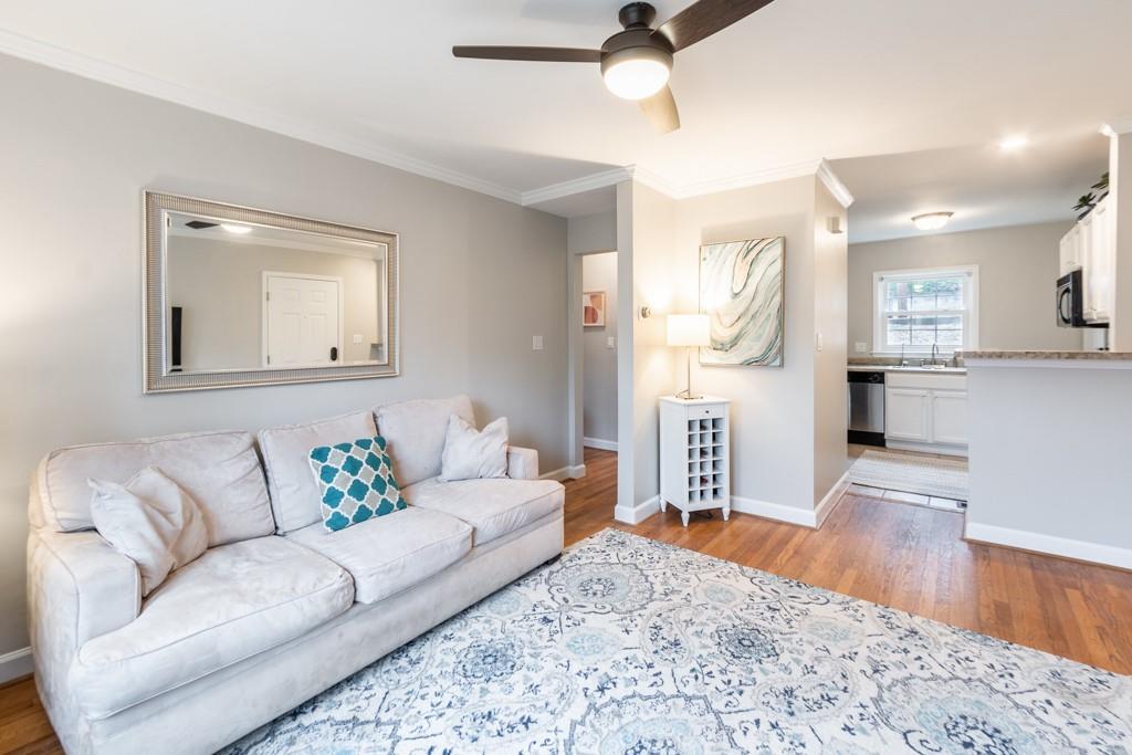 576 Goldsboro Road Northeast, Unit A Atlanta, GA 30307 - Photo 1 of 1 a living room with furniture and a wooden floor